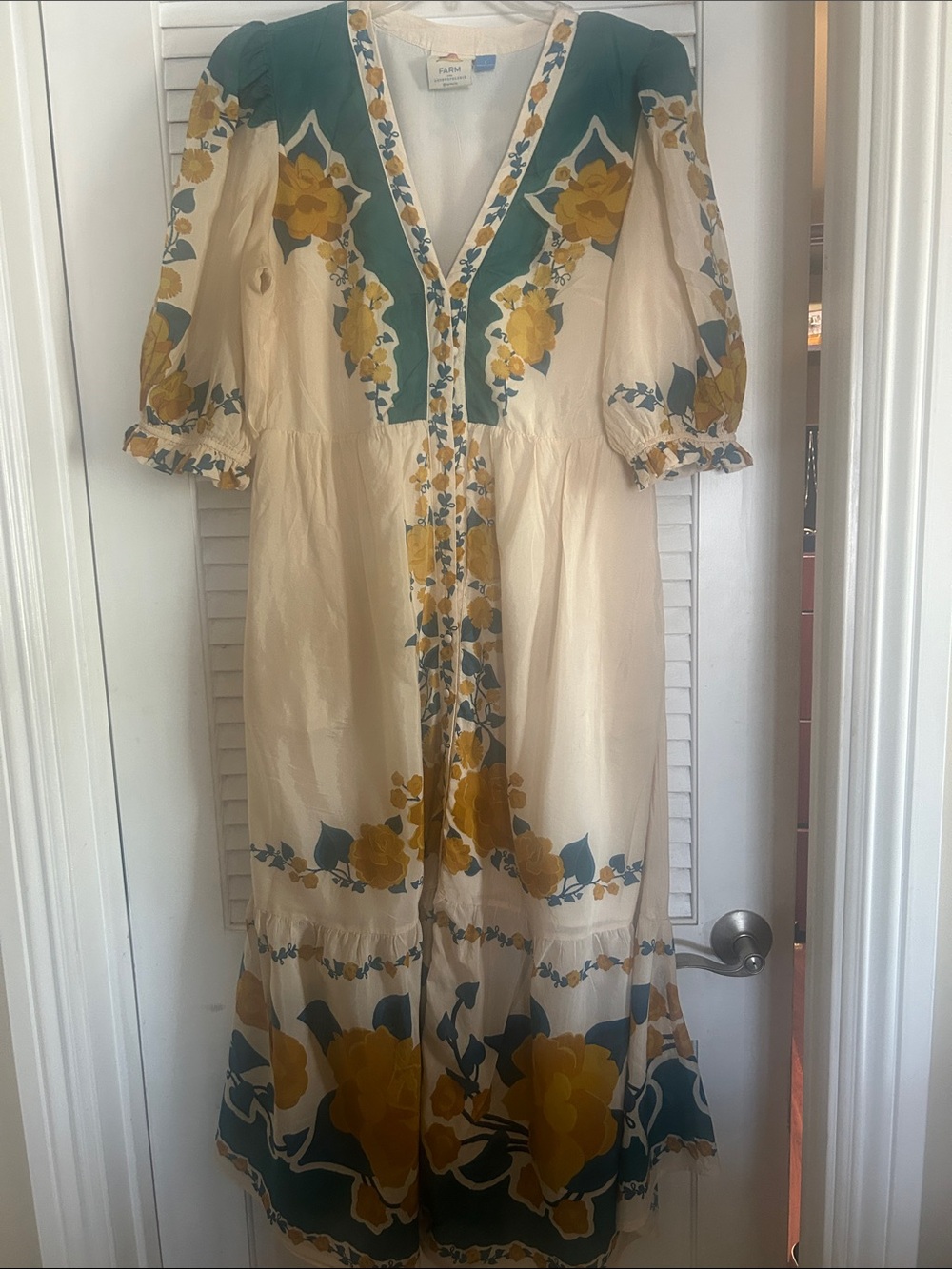 FARM Rio Cream Midi Dress with Mustard Yellow & Teal Floral Accents.
